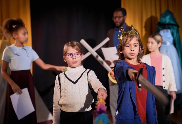 boy-and-girl-standing-on-stage-in-theater-2024-02-13-20-38-38-utc