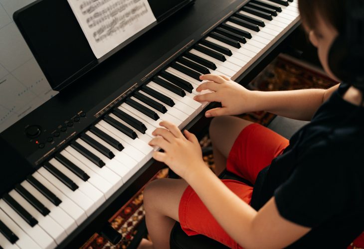 school-boy-playing-synthesizer-at-home.jpg